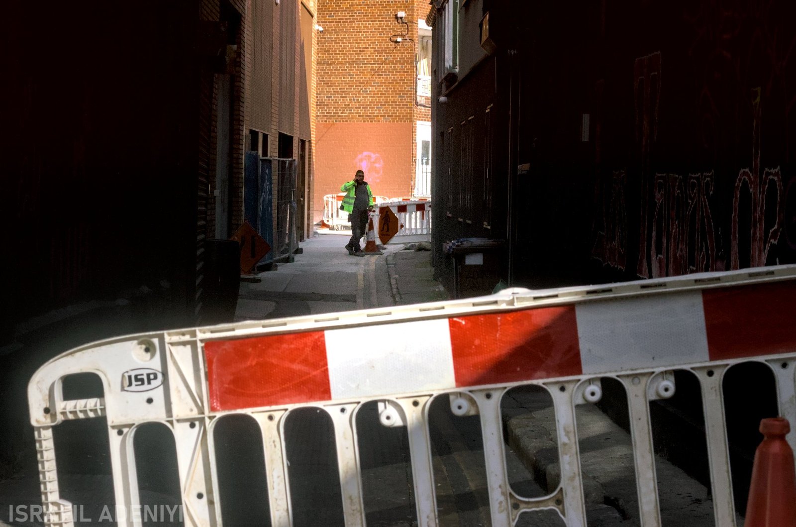 builder in an alleyway